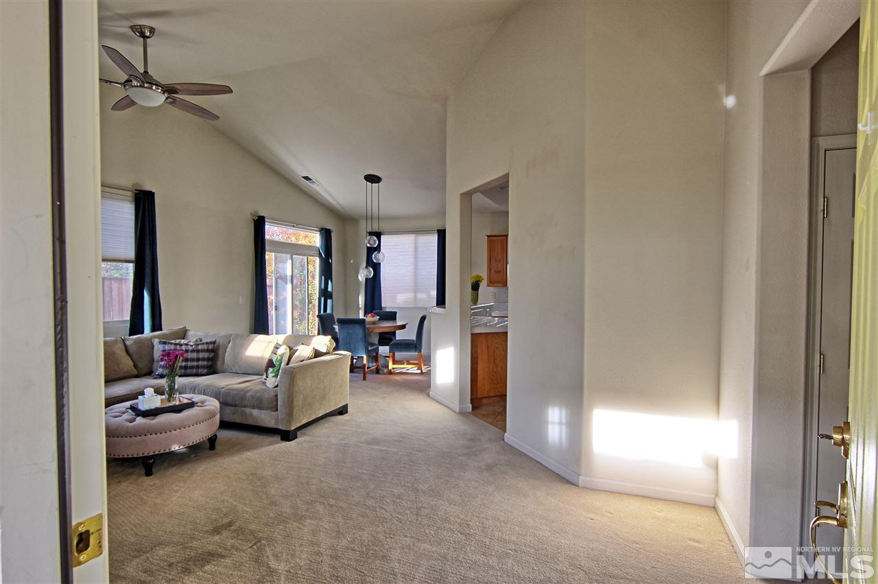 10467 Summershade Lane Reno, NV 89521 - Photo 4 of 23 a living room with furniture and a window