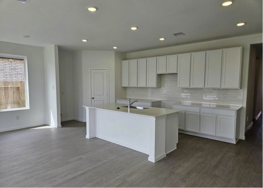 415 Robin Court Angleton, TX 77515 - Photo 3 of 9 a kitchen with a sink and cabinets
