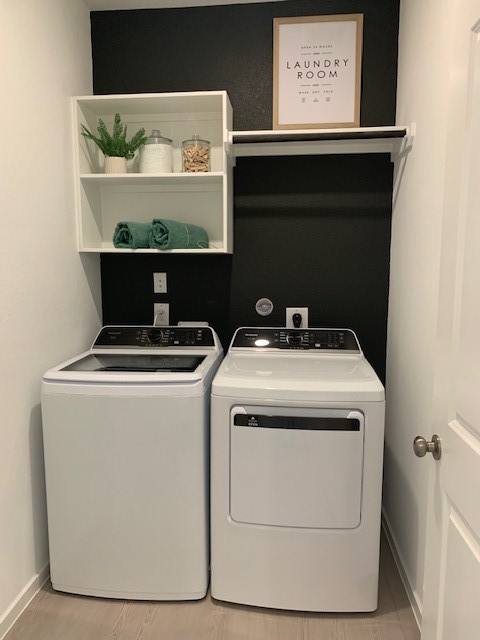 415 Robin Court Angleton, TX 77515 - Photo 7 of 9 a utility room with dryer and washer