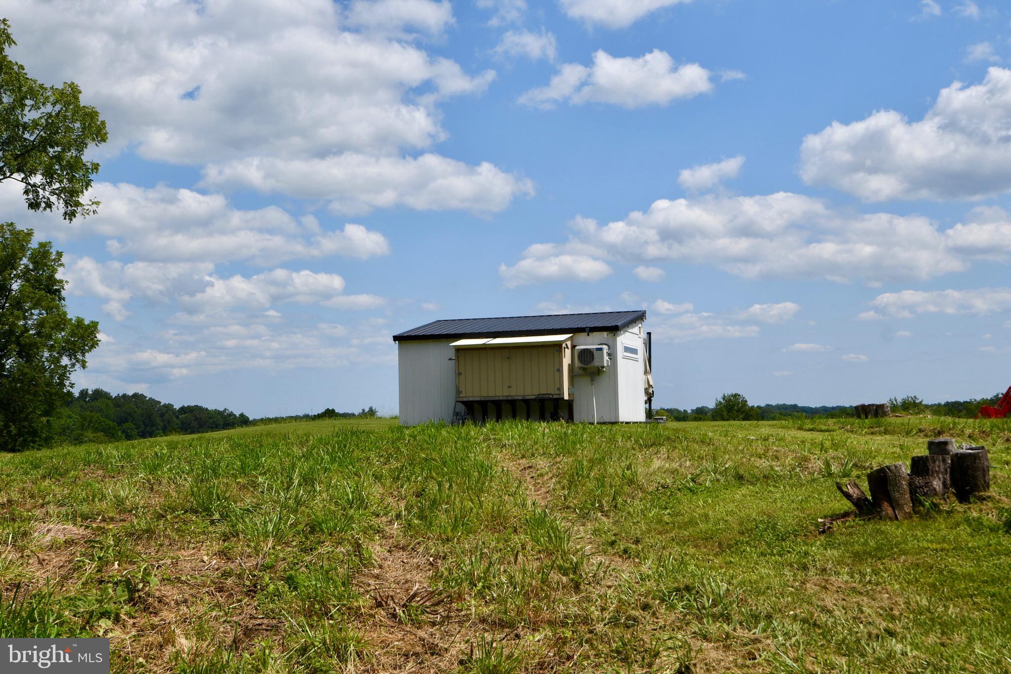 2919 Rokeby Road Delaplane, VA 20144 - Photo 19 of 40 a view of a big yard with an outdoor seating