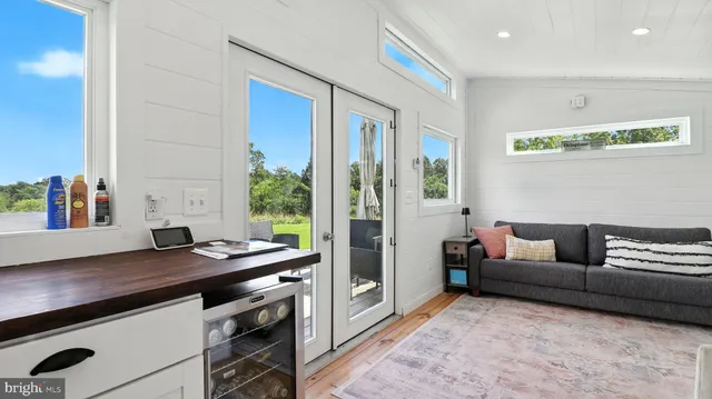 a living room with furniture and a window