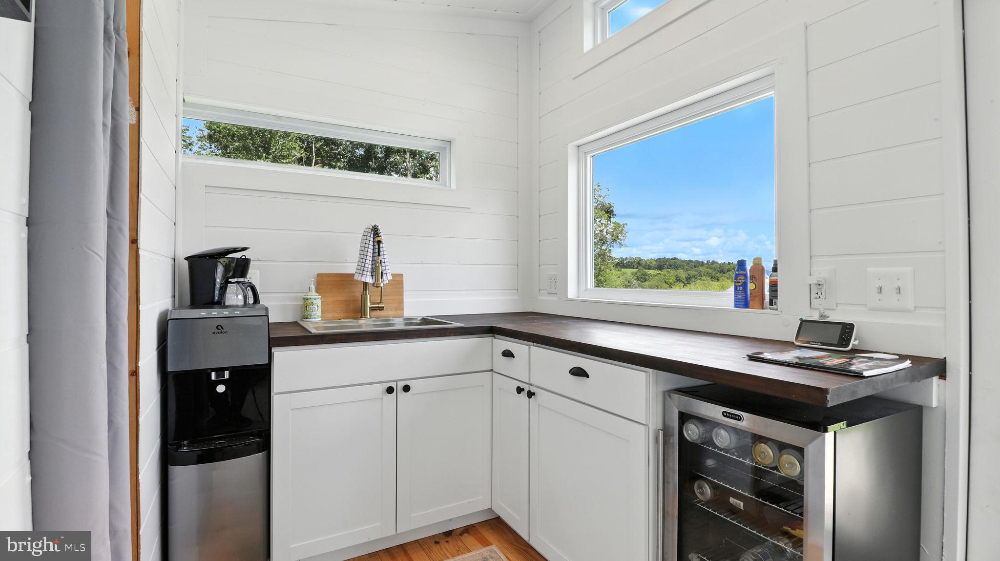 2919 Rokeby Road Delaplane, VA 20144 - Photo 6 of 40 a kitchen with a sink stove and microwave
