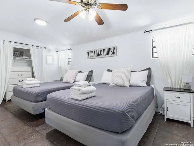 a bedroom with bed and window