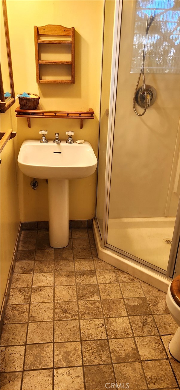 60812 Adele Road Landers, CA 92285 - Photo 15 of 19 a bathroom with a sink and a mirror