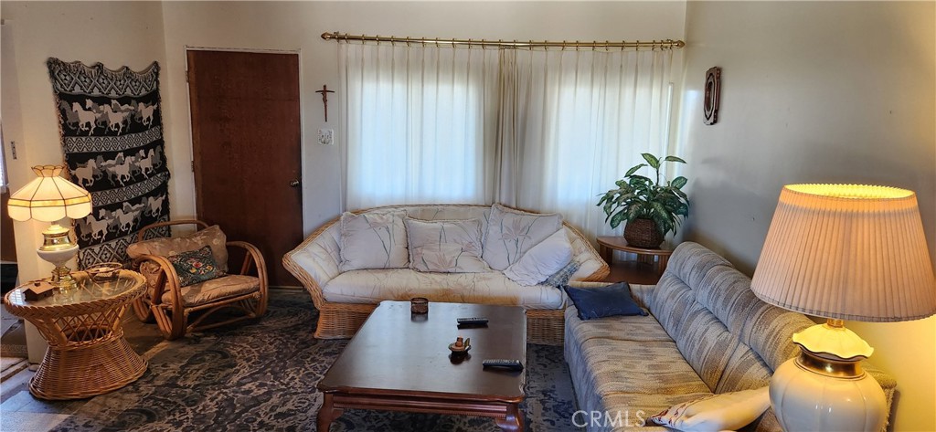 60812 Adele Road Landers, CA 92285 - Photo 4 of 19 a living room with furniture and flowers