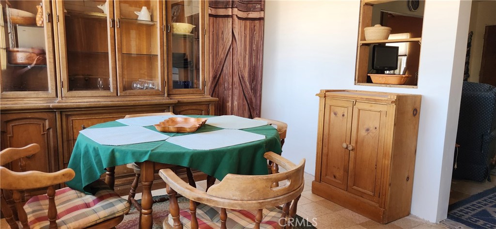 60812 Adele Road Landers, CA 92285 - Photo 8 of 19 a dining room with furniture and window