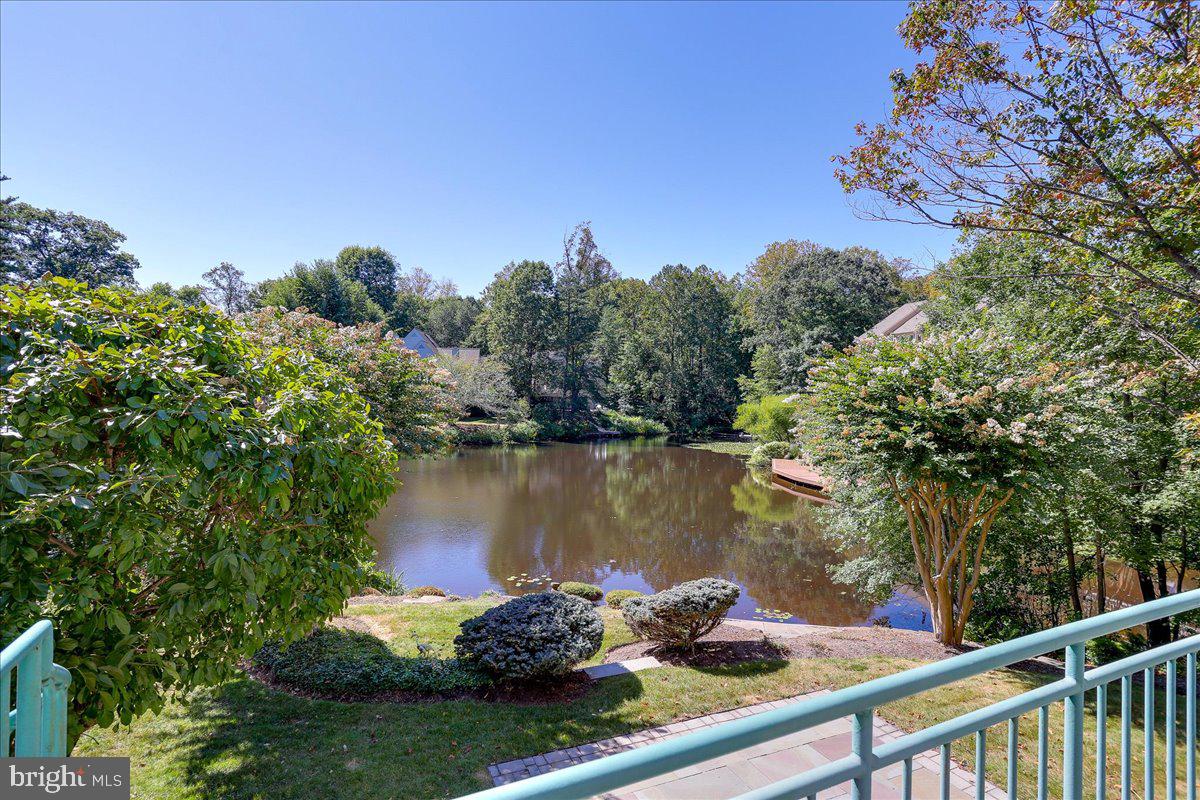1460 Waterfront Road Reston, VA 20194 - Photo 3 of 62 a view of a lake with a mountain in the background