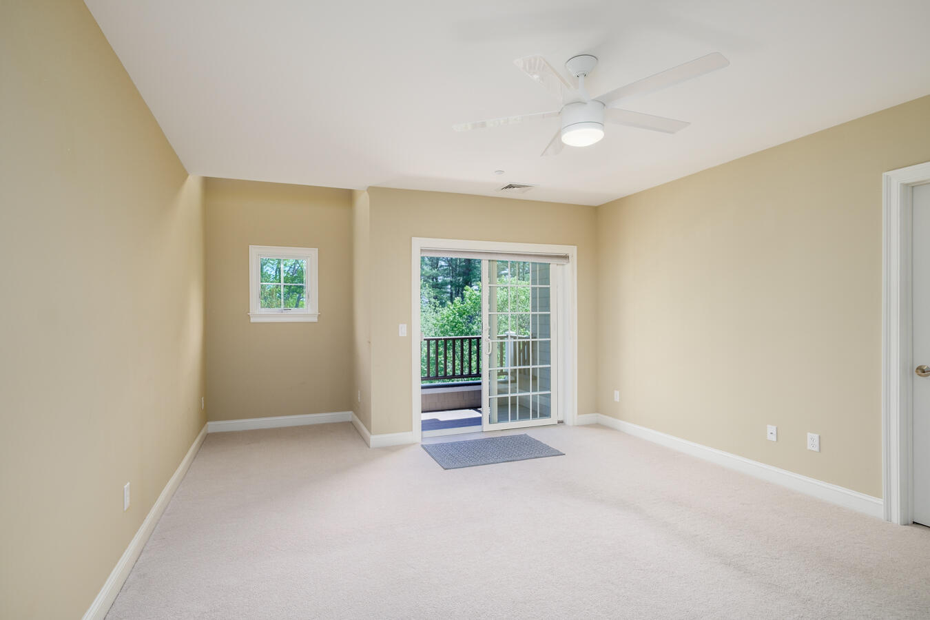 100 Shepard's Cove Road, Unit H305 Kittery, ME 03904 - Photo 21 of 45 Primary Bedroom toward the covered porch