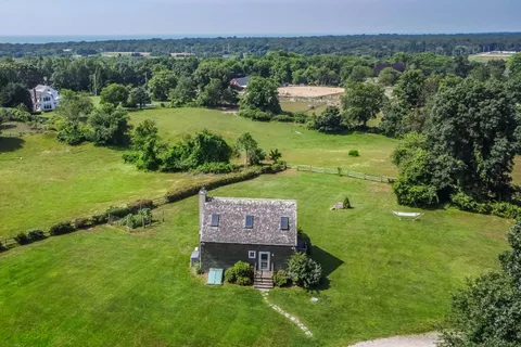 an aerial view of a houses with outdoor space