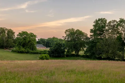 a view of outdoor space with deck and yard