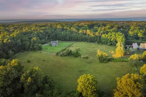 a view of a houses with a yard