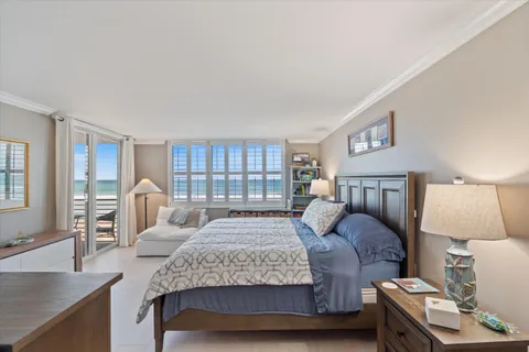 a bedroom with a large bed and a table