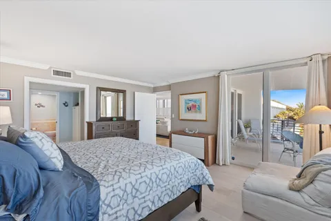 a bedroom with a large bed and a couch