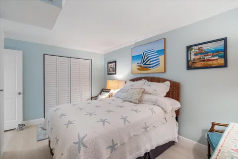 a bedroom with bed and a window