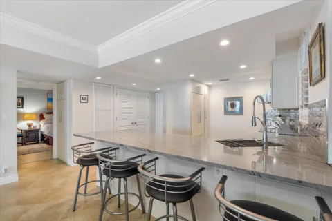 a kitchen with a table and chairs in it