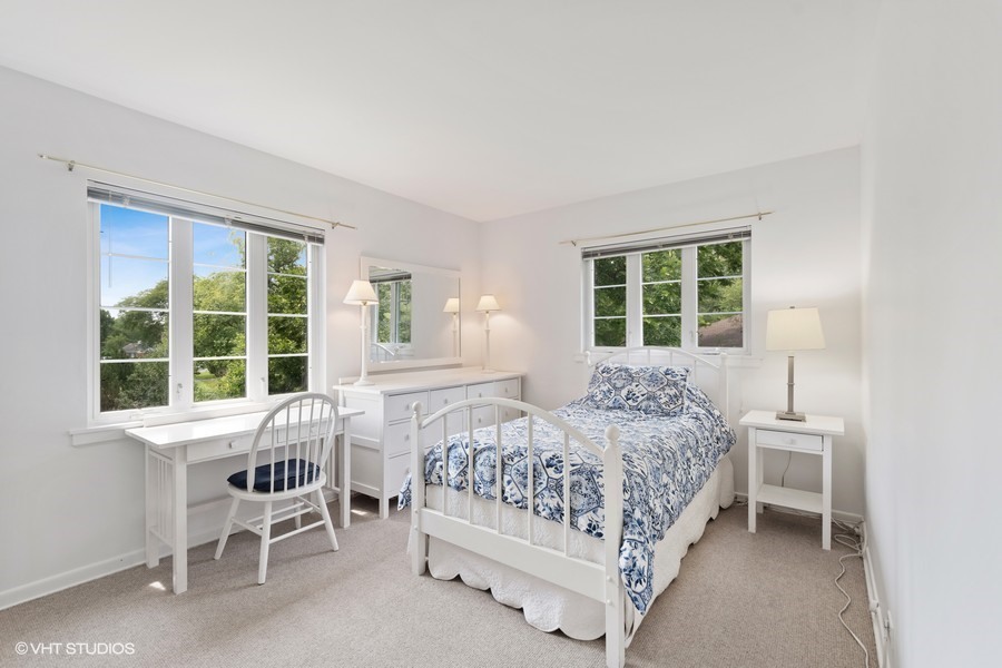 216 Summerfield Road Northbrook, IL 60062 - Photo 22 of 33 a bedroom with a bed a table and windows