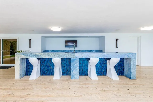 a bathroom with a shower and a glass door