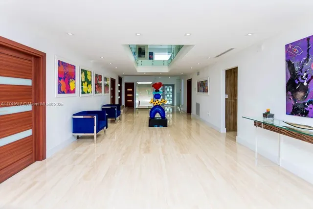 a room with pool table and windows