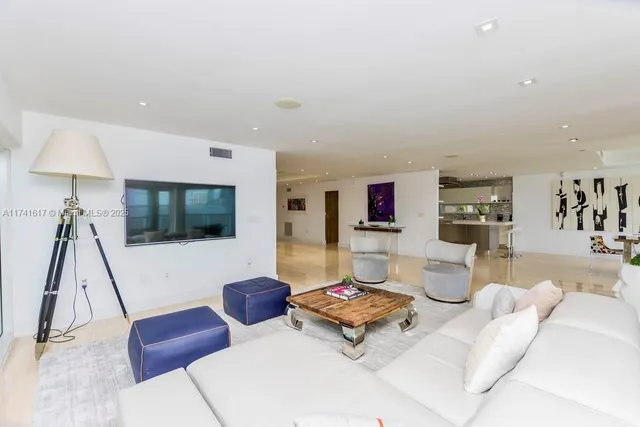 a living room with furniture gym equipment and a window