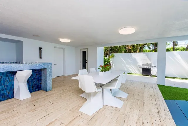 a bathroom with a sink a toilet a mirror and shower