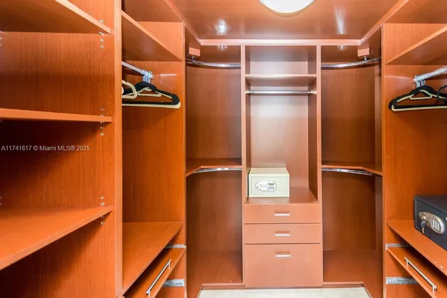 a spacious bathroom with a granite countertop tub sink and shower