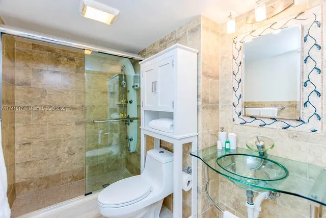 a bedroom with a bed and a lamp