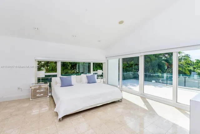 a bedroom with a bed and a cabinets