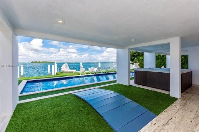 a kitchen with granite countertop a stove top oven a sink and a granite counter top