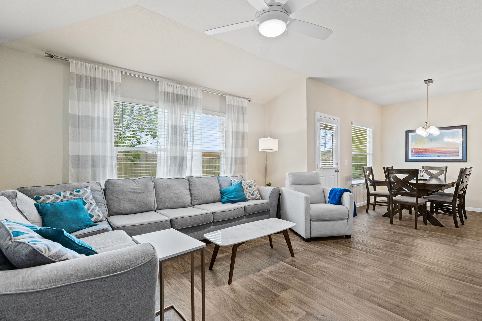404 Cassandra Drive Hutto, TX 78634 - Photo 5 of 40 Living area featuring wood finished floors and ceiling fan