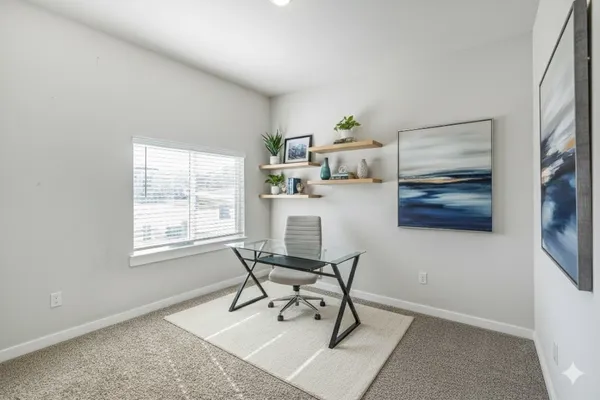 a workspace with furniture and window