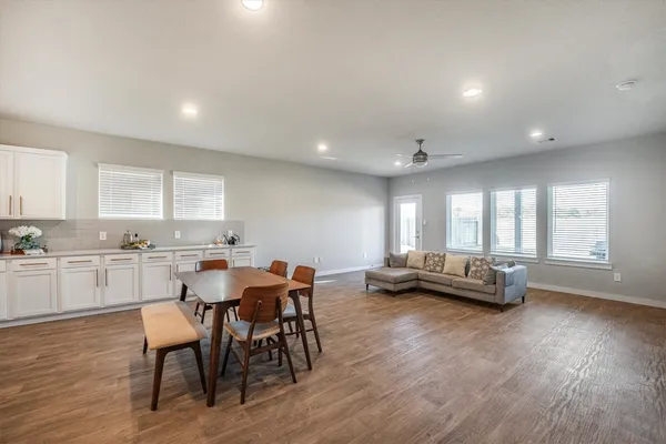 a view of kitchen with dining table and chairs