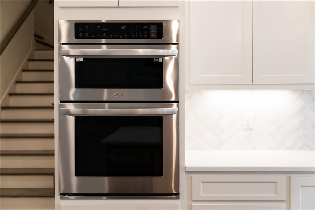 1 Cason Drive Canton, GA 30114 - Photo 13 of 28 a stove top oven sitting inside of a kitchen