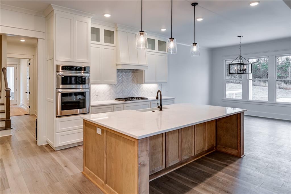 1 Cason Drive Canton, GA 30114 - Photo 14 of 28 a kitchen with a stove a sink and a refrigerator