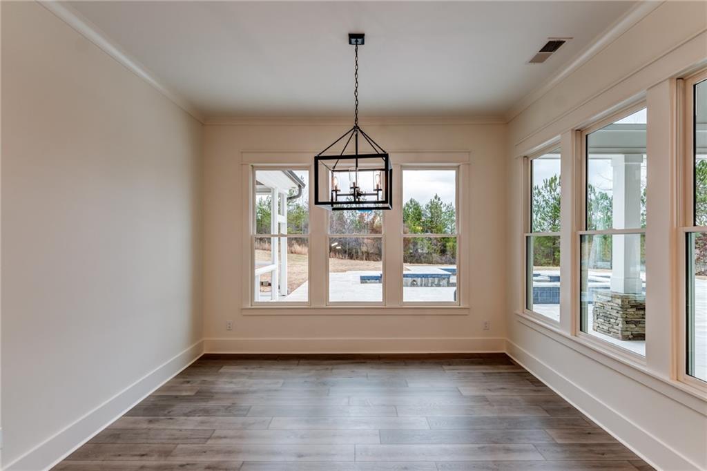 1 Cason Drive Canton, GA 30114 - Photo 15 of 28 a view of an empty room with wooden floor and a window