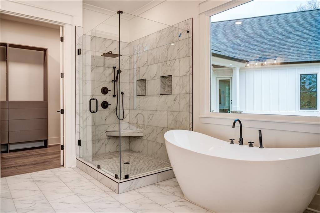 1 Cason Drive Canton, GA 30114 - Photo 18 of 28 a bathroom with a shower and mirror