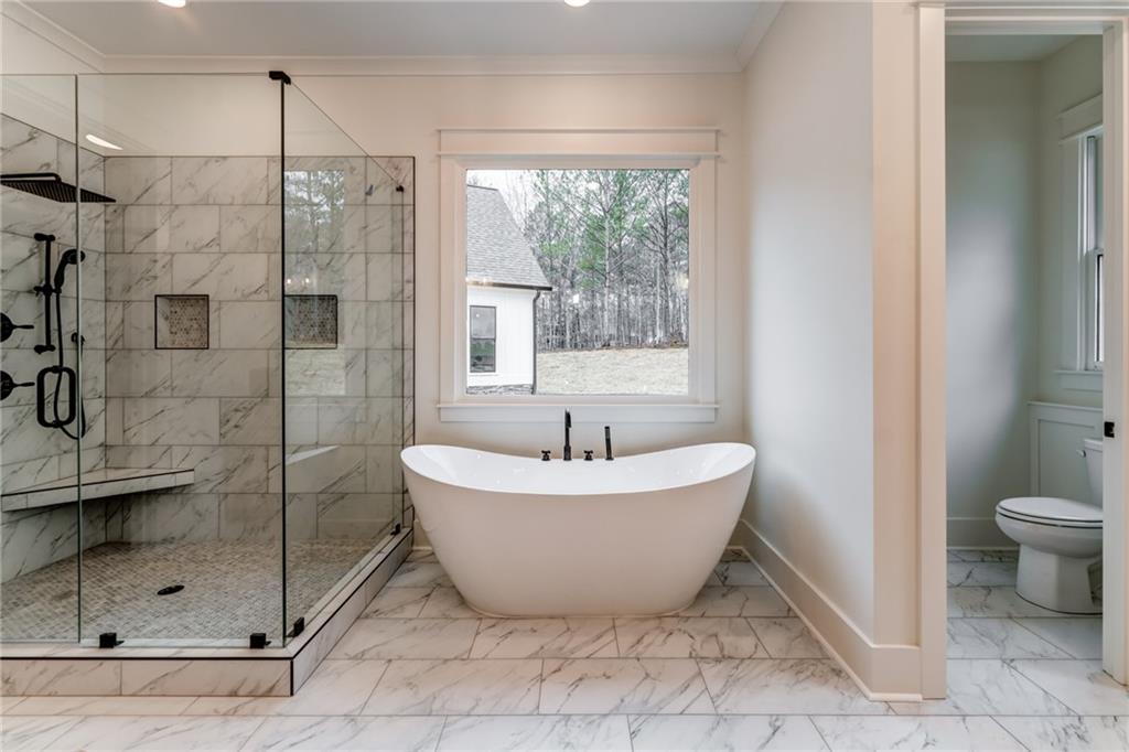 1 Cason Drive Canton, GA 30114 - Photo 19 of 28 a bathroom with a sink toilet and shower
