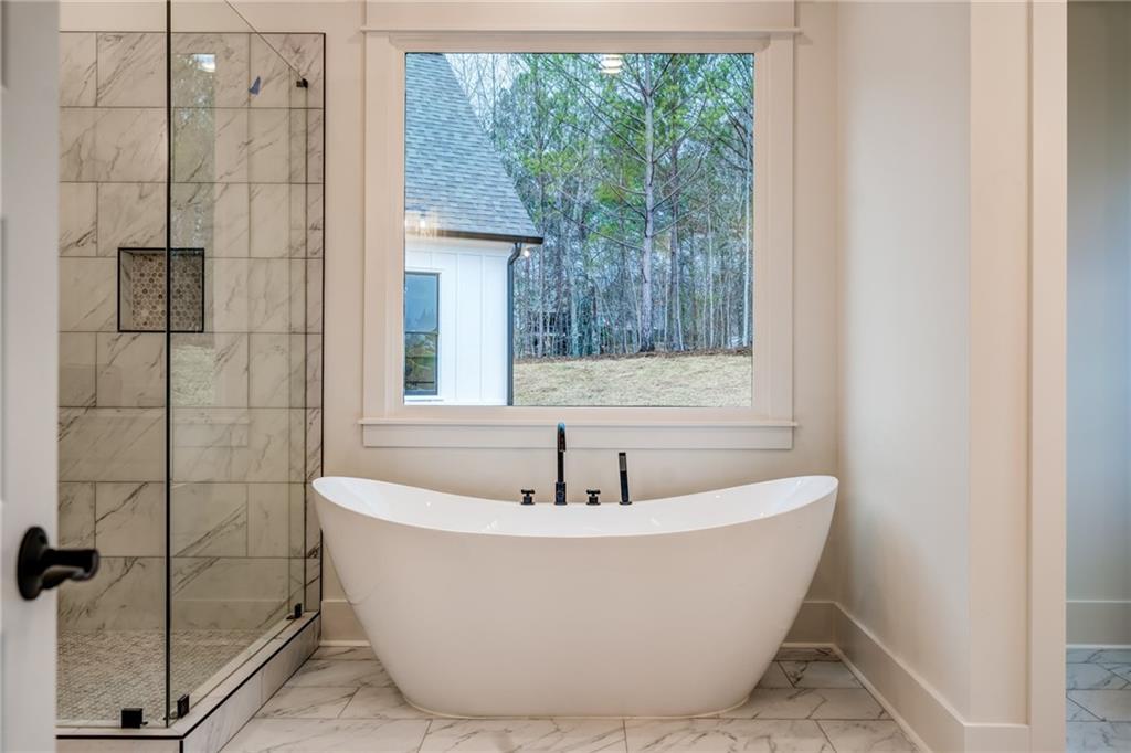 1 Cason Drive Canton, GA 30114 - Photo 20 of 28 a white bath tub sitting next to a shower
