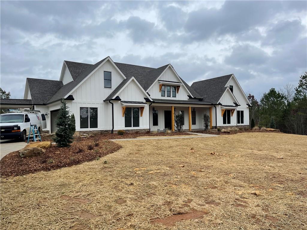 1 Cason Drive Canton, GA 30114 - Photo 3 of 28 a front view of a house with a yard and garage