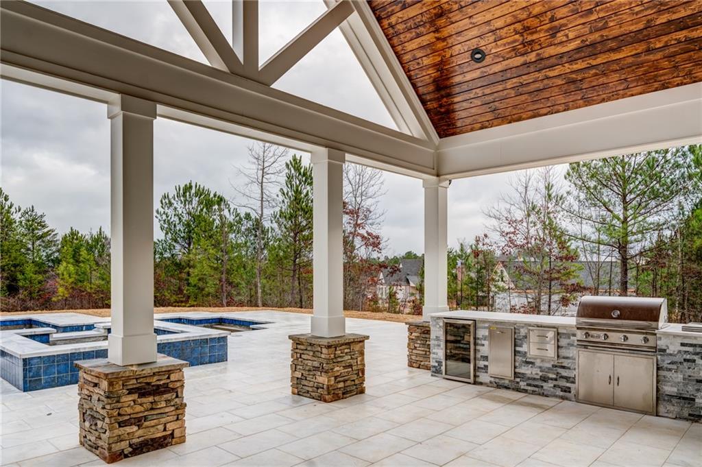 1 Cason Drive Canton, GA 30114 - Photo 4 of 28 a outdoor living space with patio furniture and a potted plant