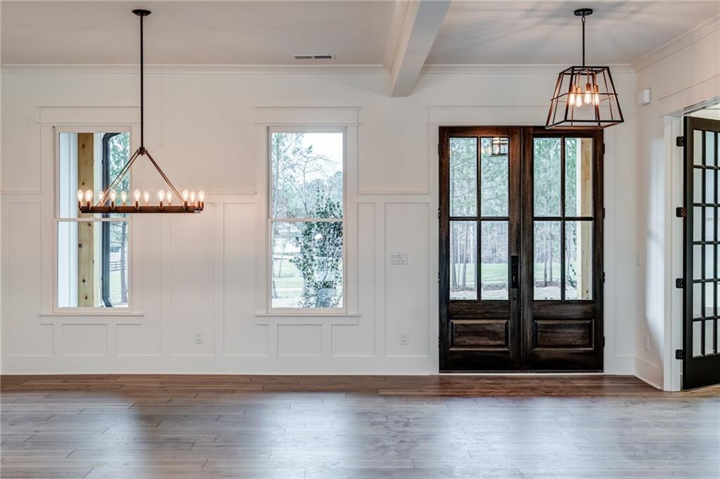 1 Cason Drive Canton, GA 30114 - Photo 5 of 28 a view of an empty room with wooden floor and a window