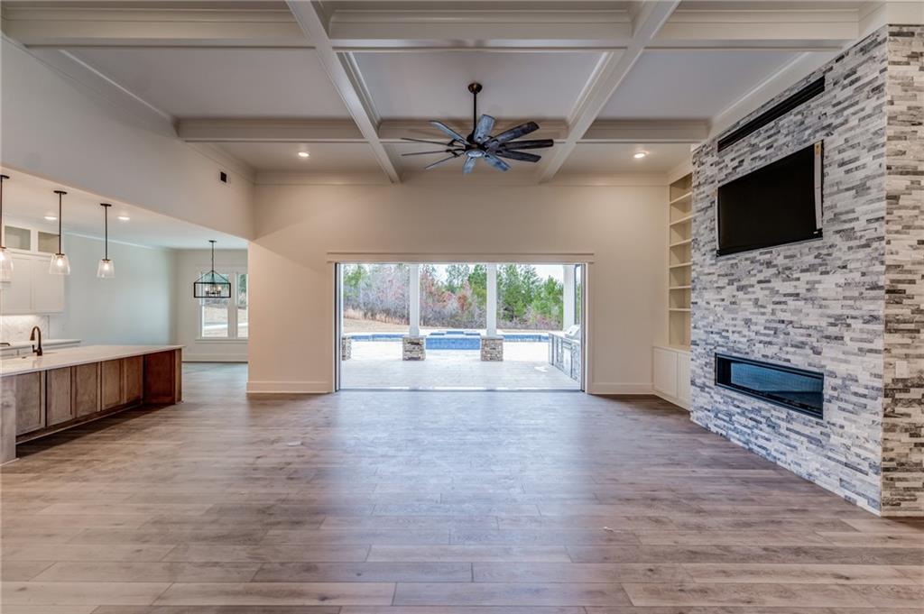 1 Cason Drive Canton, GA 30114 - Photo 6 of 28 a view of an empty room with a fireplace and a window