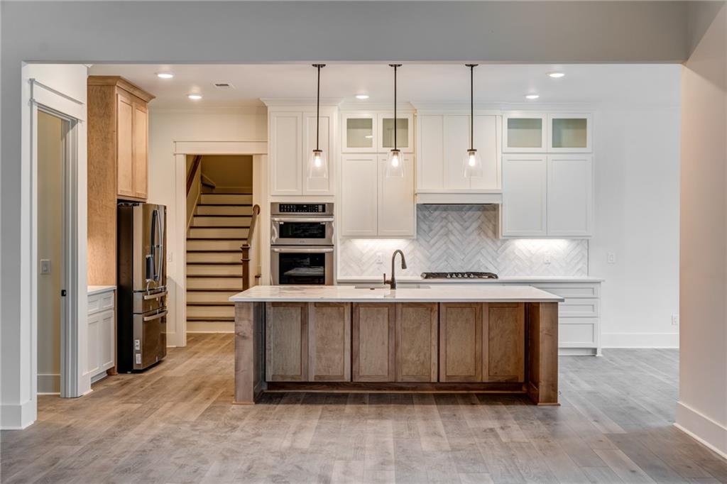1 Cason Drive Canton, GA 30114 - Photo 10 of 28 a kitchen with stainless steel appliances a sink and cabinets