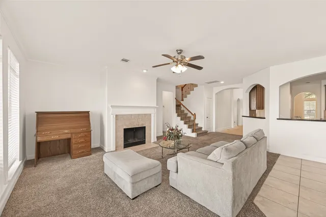 a living room with furniture and a fireplace
