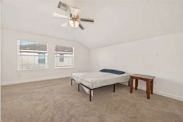 a view of a room with a cabinet and mirrors