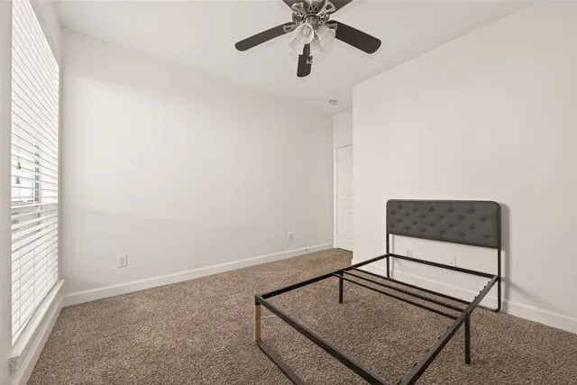a view of a room with furniture and wooden floor