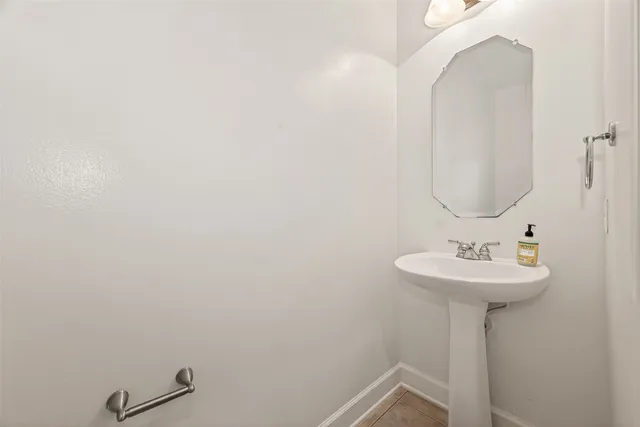 a living room filled with furniture and a chandelier