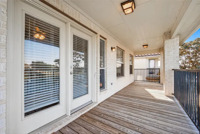 a view of a lake with a yard and outdoor seating