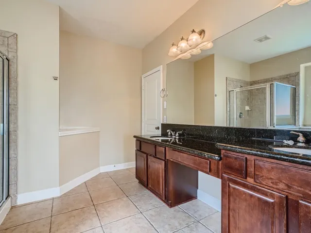 a kitchen with stainless steel appliances granite countertop a sink and a stove