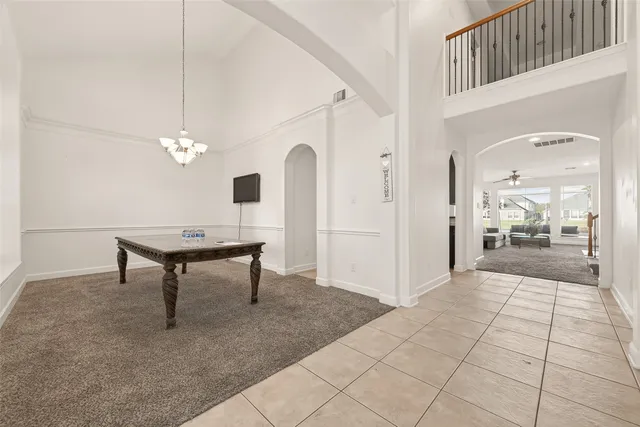 a view of a livingroom with furniture and a chandelier