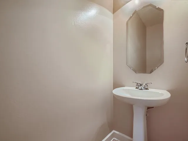 a bathroom with a sink and mirror